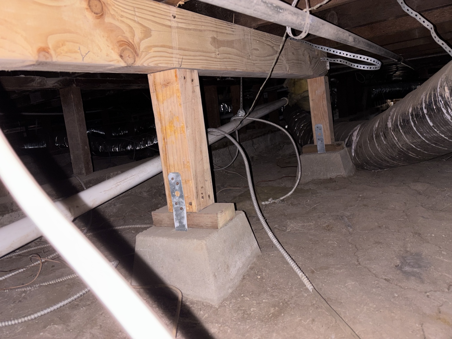Long view of reinforced floor support line beneath the house