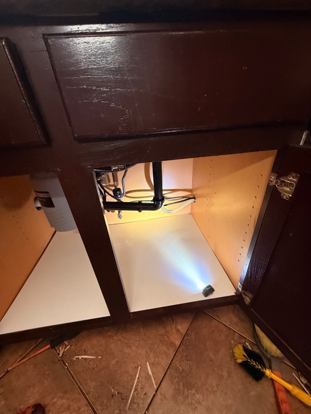 Under-sink cabinet bottom and garbage disposal replacement by ALEXKO LLC