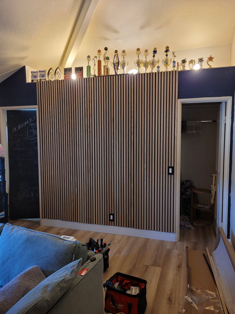 Vertical decorative slat wall feature between two interior doorways